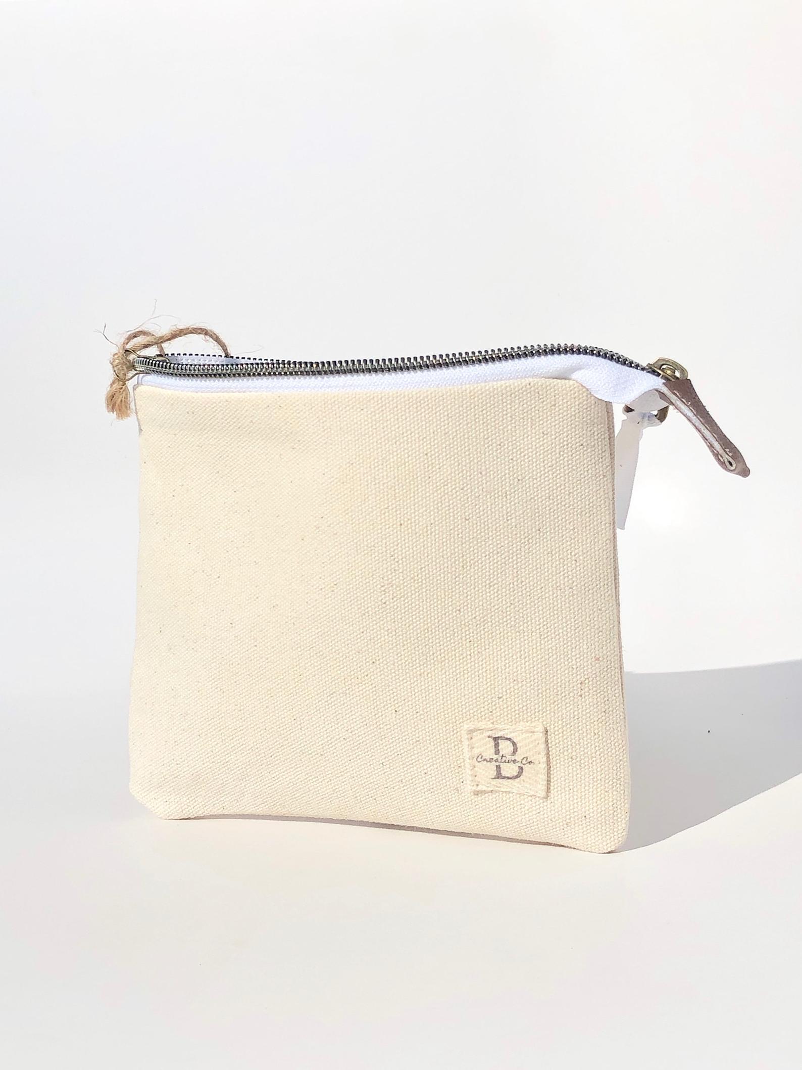 Small canvas pouch with zipper outlet